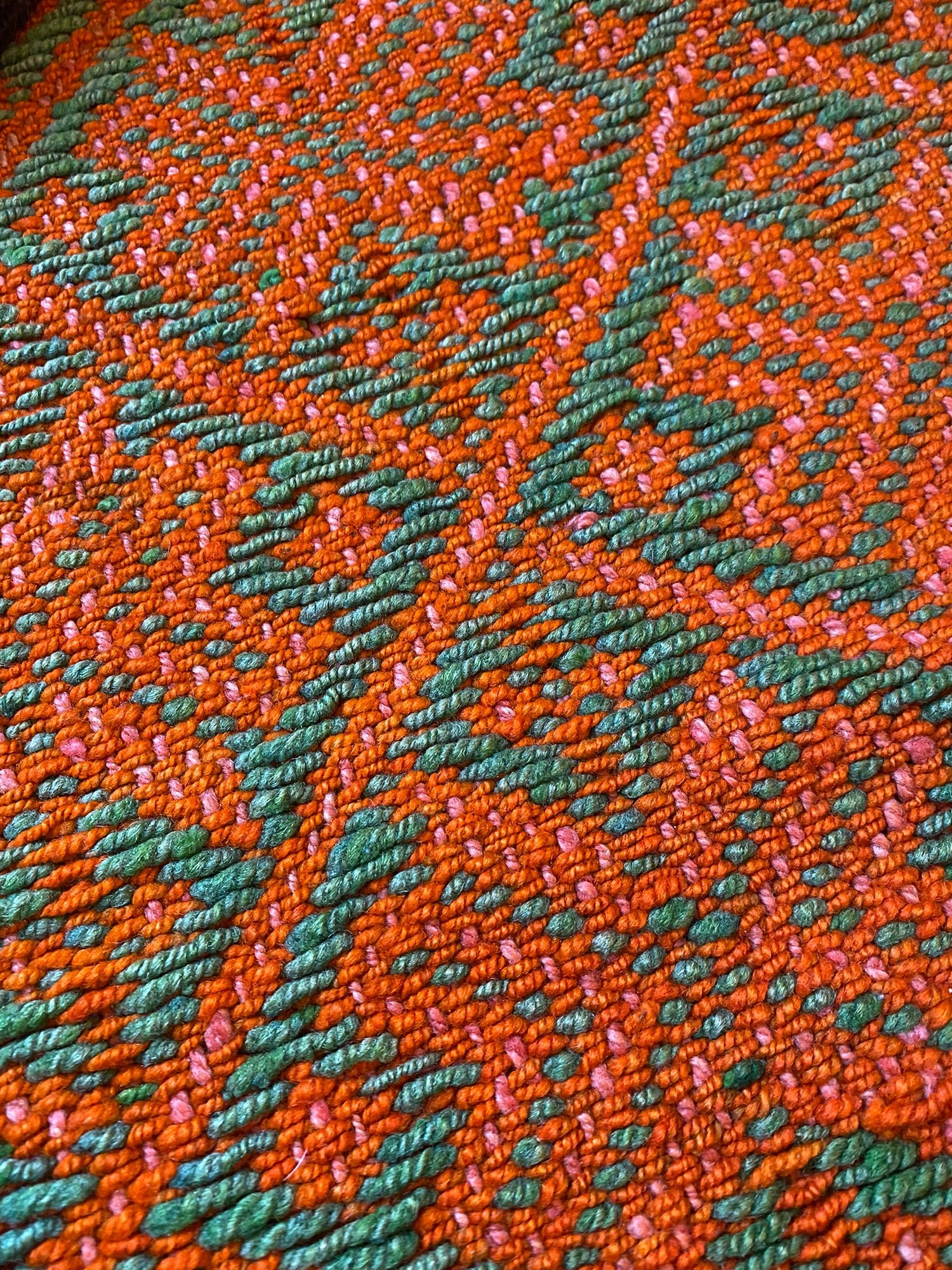 Peruanischer oranger Teppich Detailaufnahme