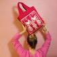 Magenta Tasche mit Te Amo Motiv und Vögelchen auf rosa Hintergrund